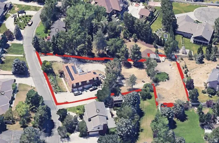 View of property location featuring nearby suburban area and property boundaries highlighted