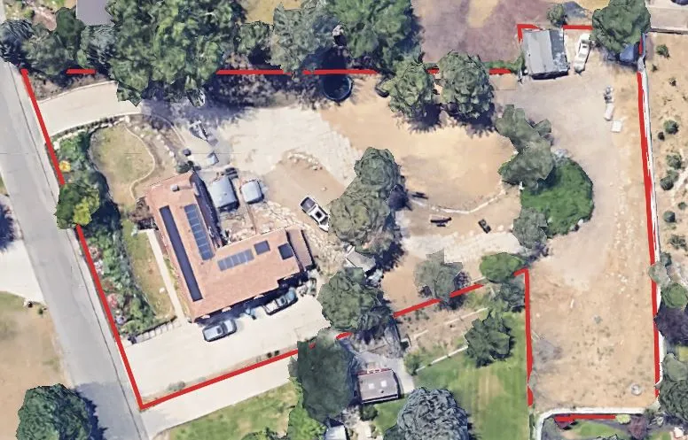 Aerial overview of property's location featuring property parcel outlined