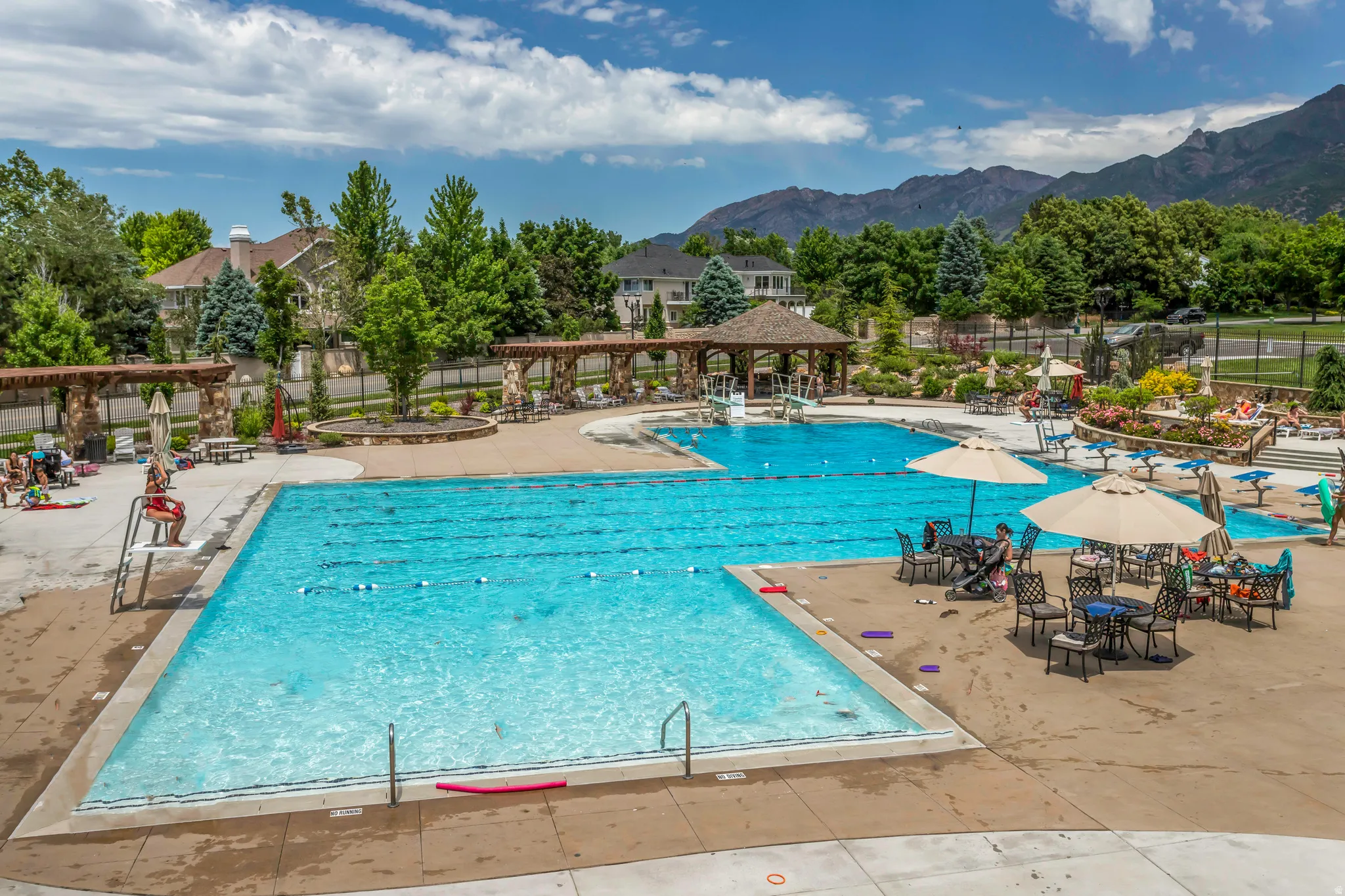 Community pool featuring a patio area and a mountain view