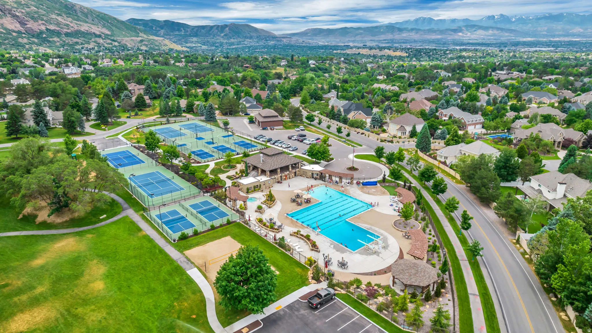 Aerial view of a mountain backdrop and a pool