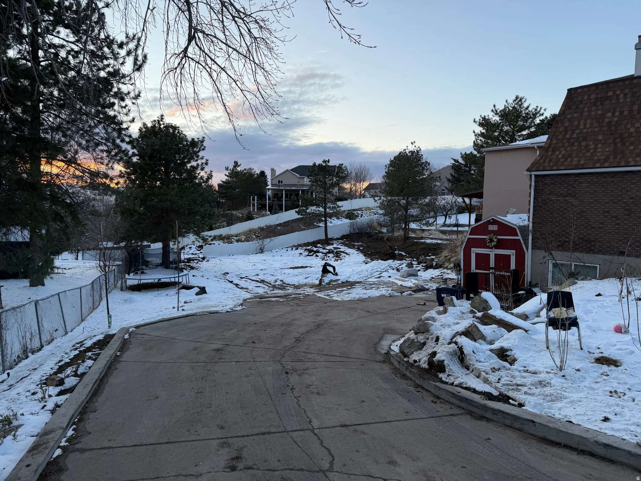 View of concrete road with curbs