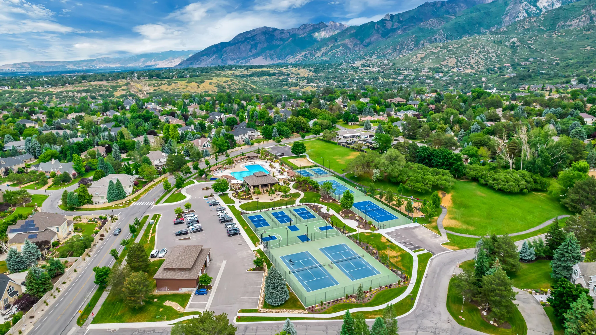 Bird's eye view of a mountain backdrop and a pool area