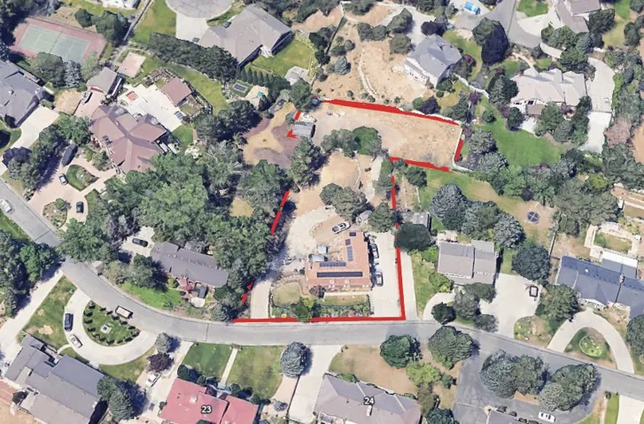 Aerial view of property's location featuring nearby suburban area and property boundaries highlighted