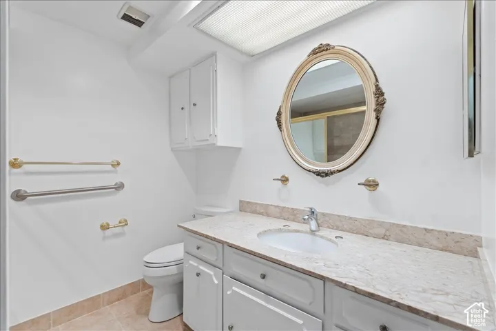 Bathroom featuring vanity and light tile patterned floors