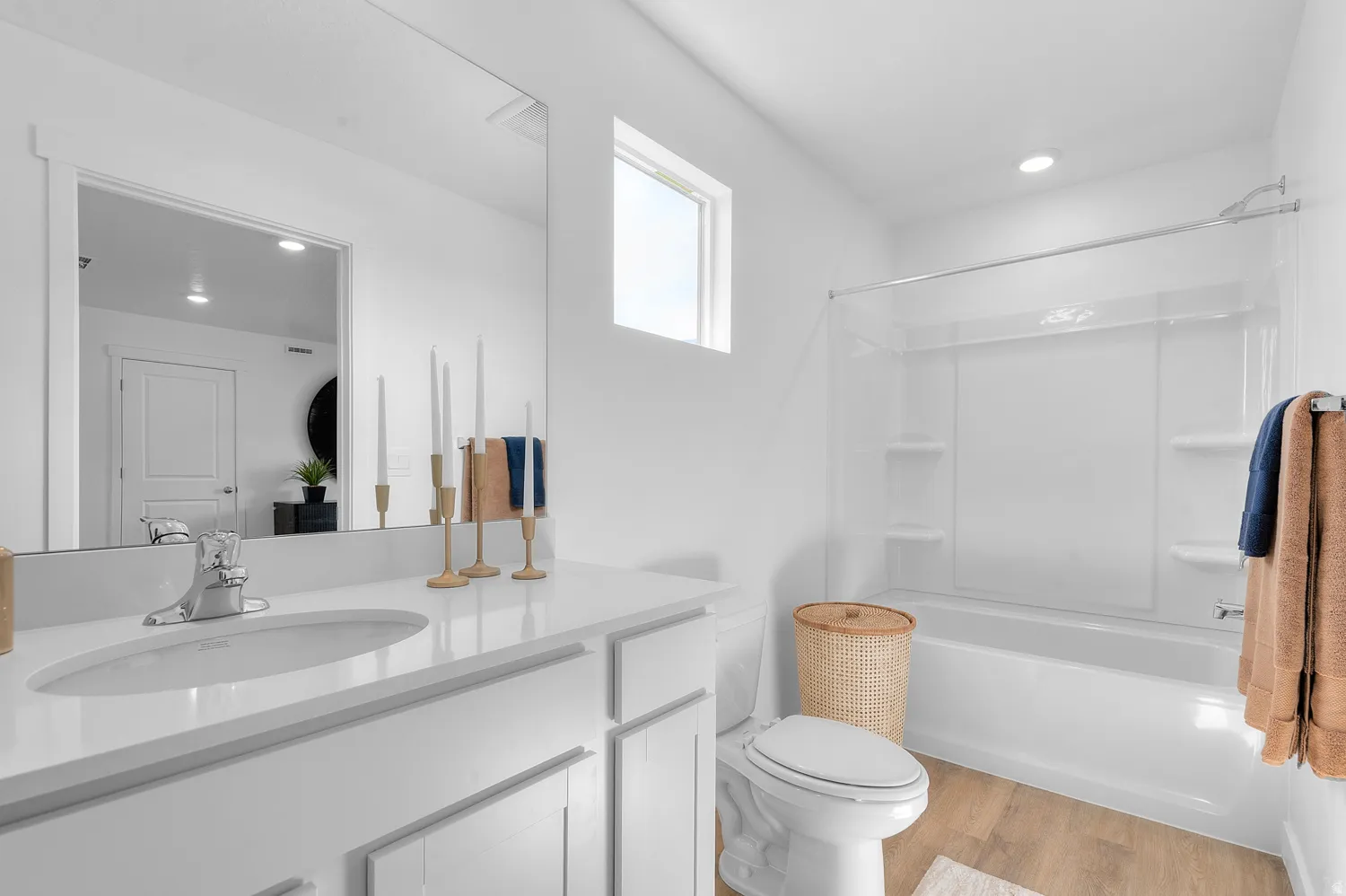 Full bath featuring vanity, recessed lighting, light wood finished floors, and washtub / shower combination
