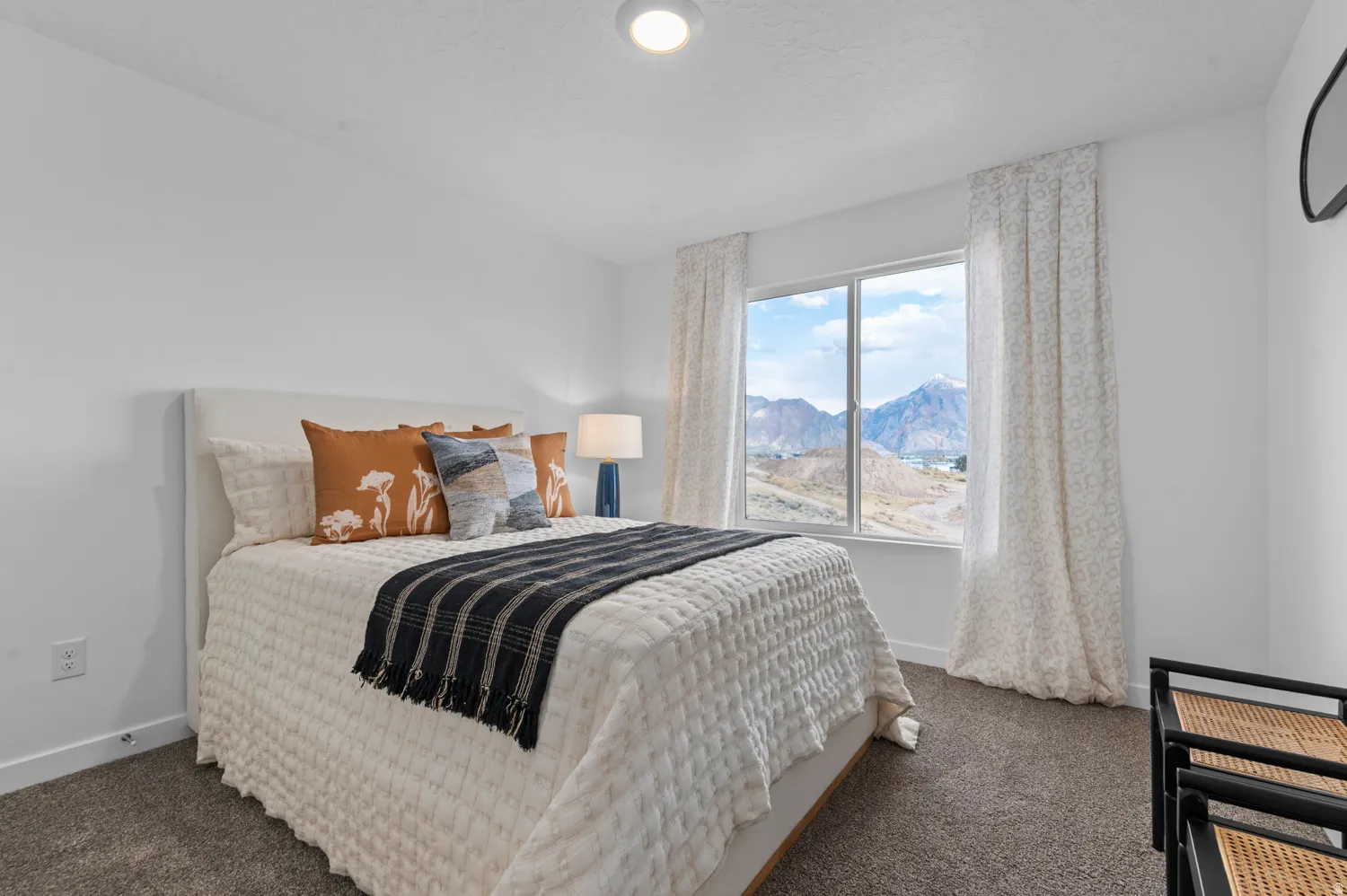 Bedroom with a mountain view and carpet