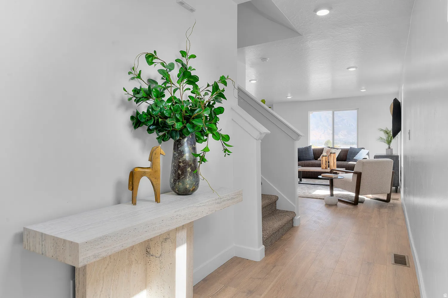Hall featuring light wood-style floors and recessed lighting