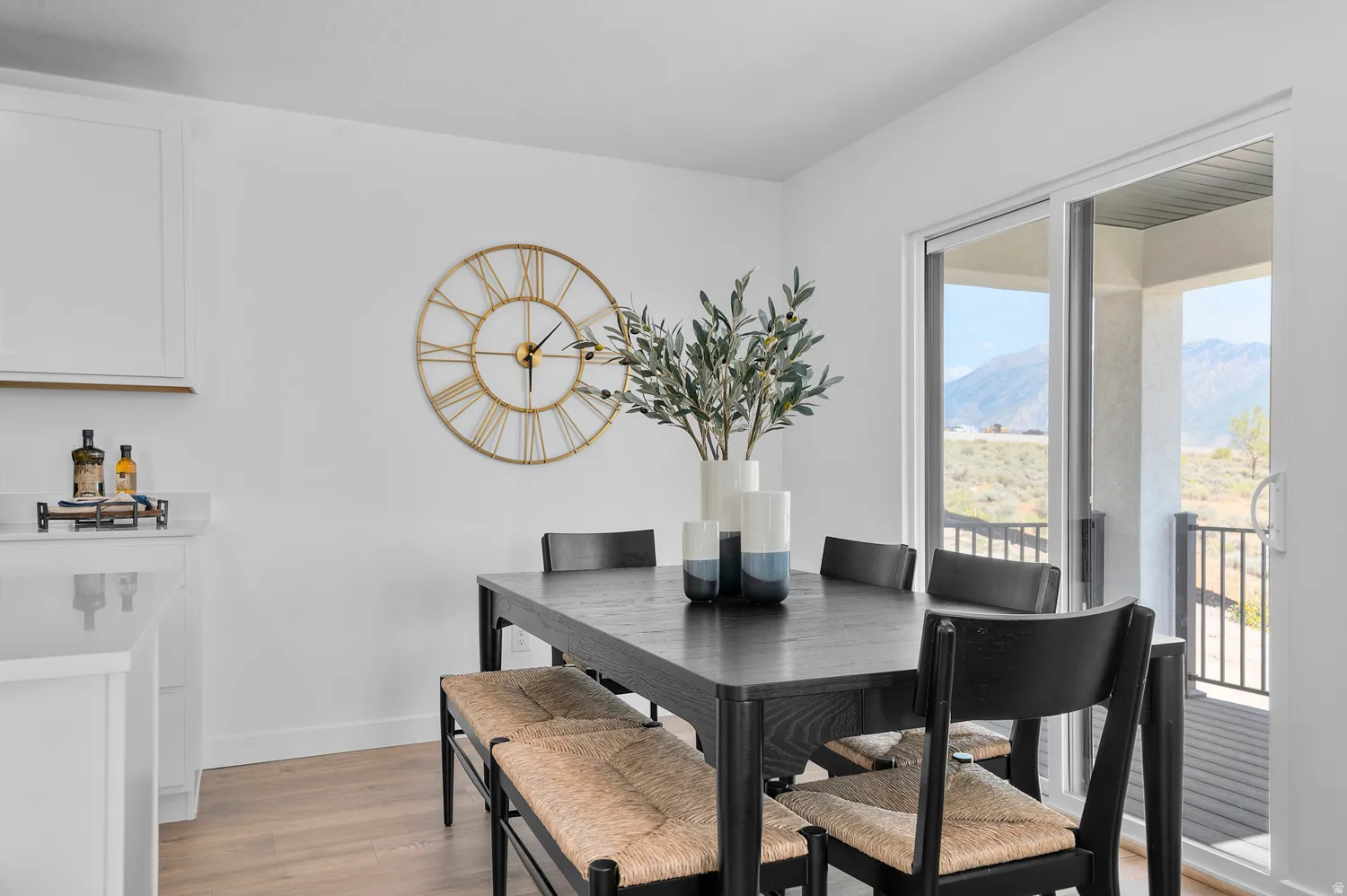 Dining room featuring light wood finished floors and a mountain view