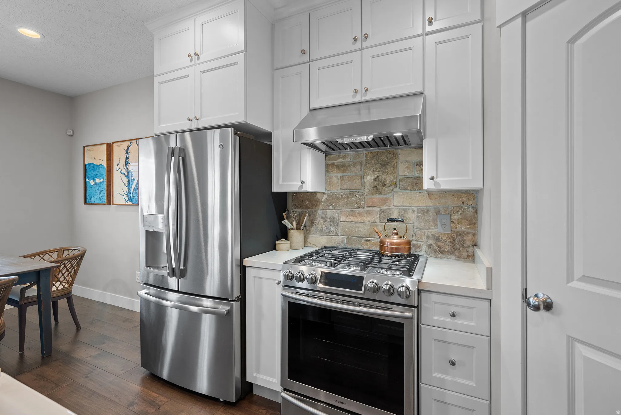 Professional grade stainless steel stove and hood, very rare that hood is vented to the exterior.