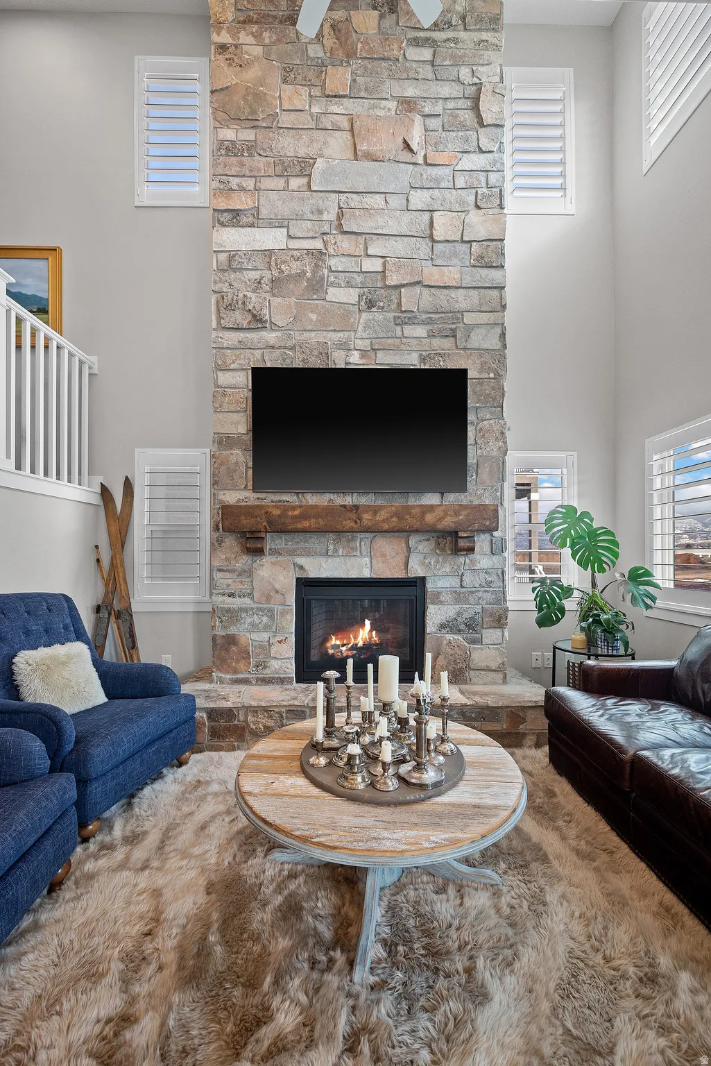 22 ft, floor to ceiling natural Stone fireplace with custom mantel and hearth