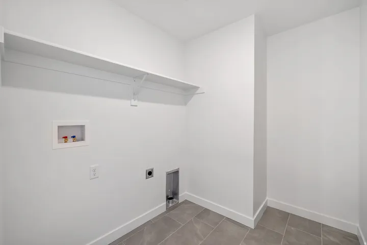 Laundry room with hookup for a washing machine and hookup for an electric dryer