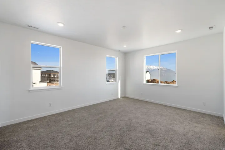 Spare room with carpet flooring and baseboards