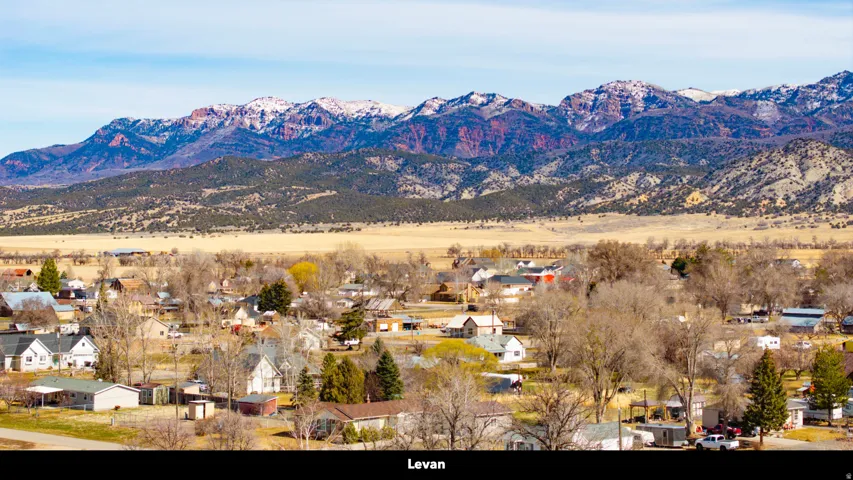View of mountain background featuring nearby suburban area