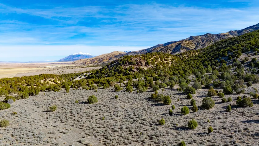 View of mountain backdrop featuring a desert landscape