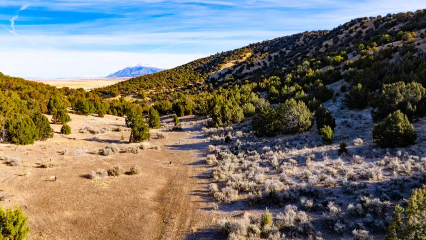 View of mountain background featuring rural landscape