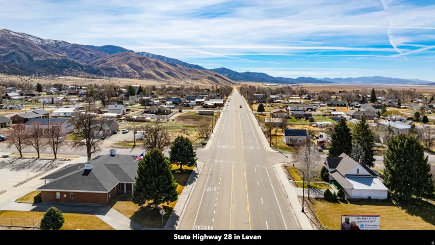 Aerial perspective of suburban area featuring a mountainous background