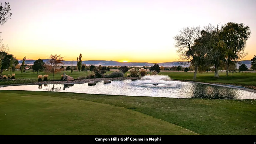 View of community featuring a water and mountain view and view of golf course