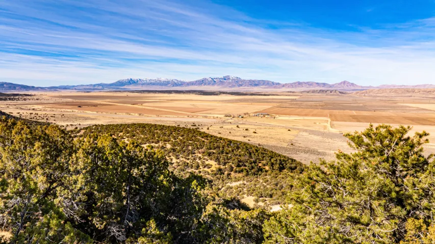 View of mountain background featuring rural landscape