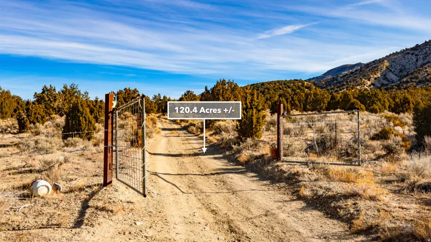 View of street featuring a gate and a mountain view