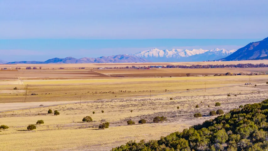 View of mountain background featuring rural landscape