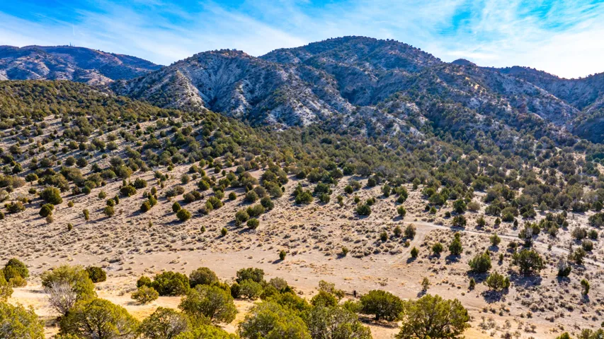 View of mountain backdrop featuring rural landscape and a desert landscape