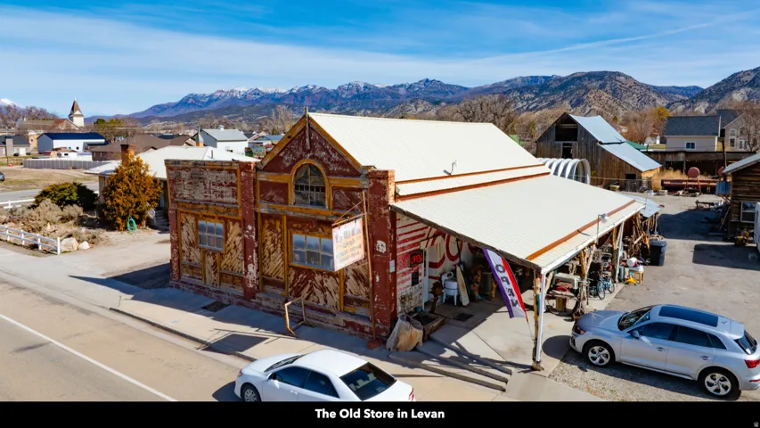 View of front of house with a mountain view, a metal roof, and a residential view