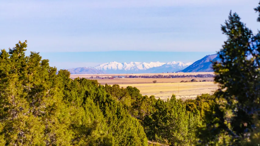 View of mountain backdrop featuring rural landscape