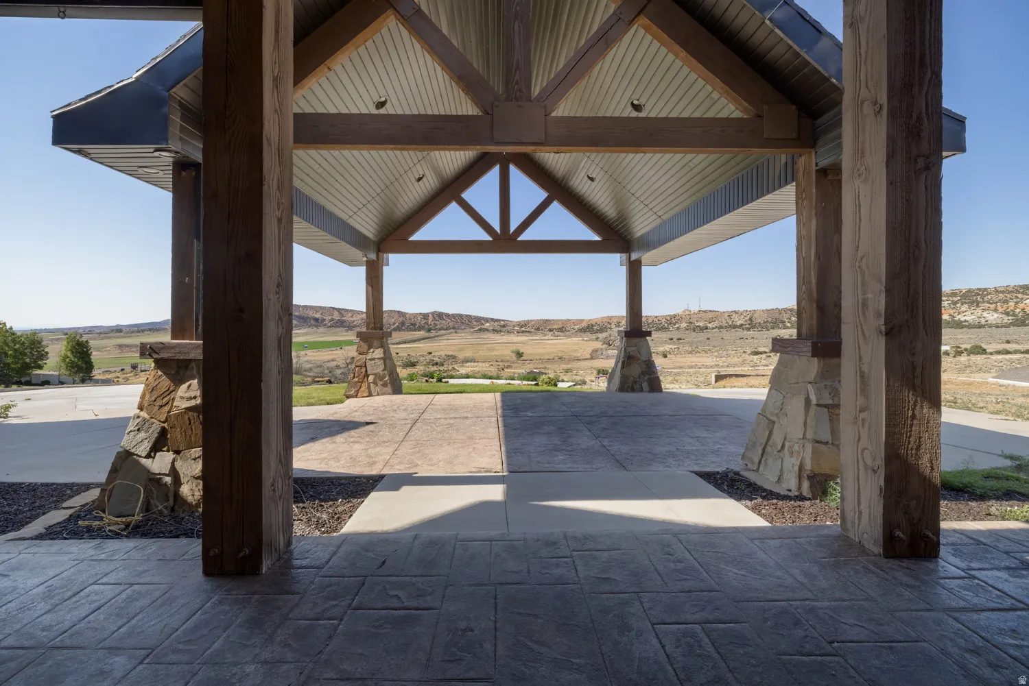 View of patio featuring a mountain view and a view of countryside