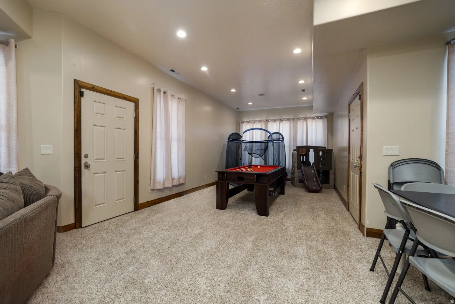 Playroom featuring light carpet, pool table, and recessed lighting