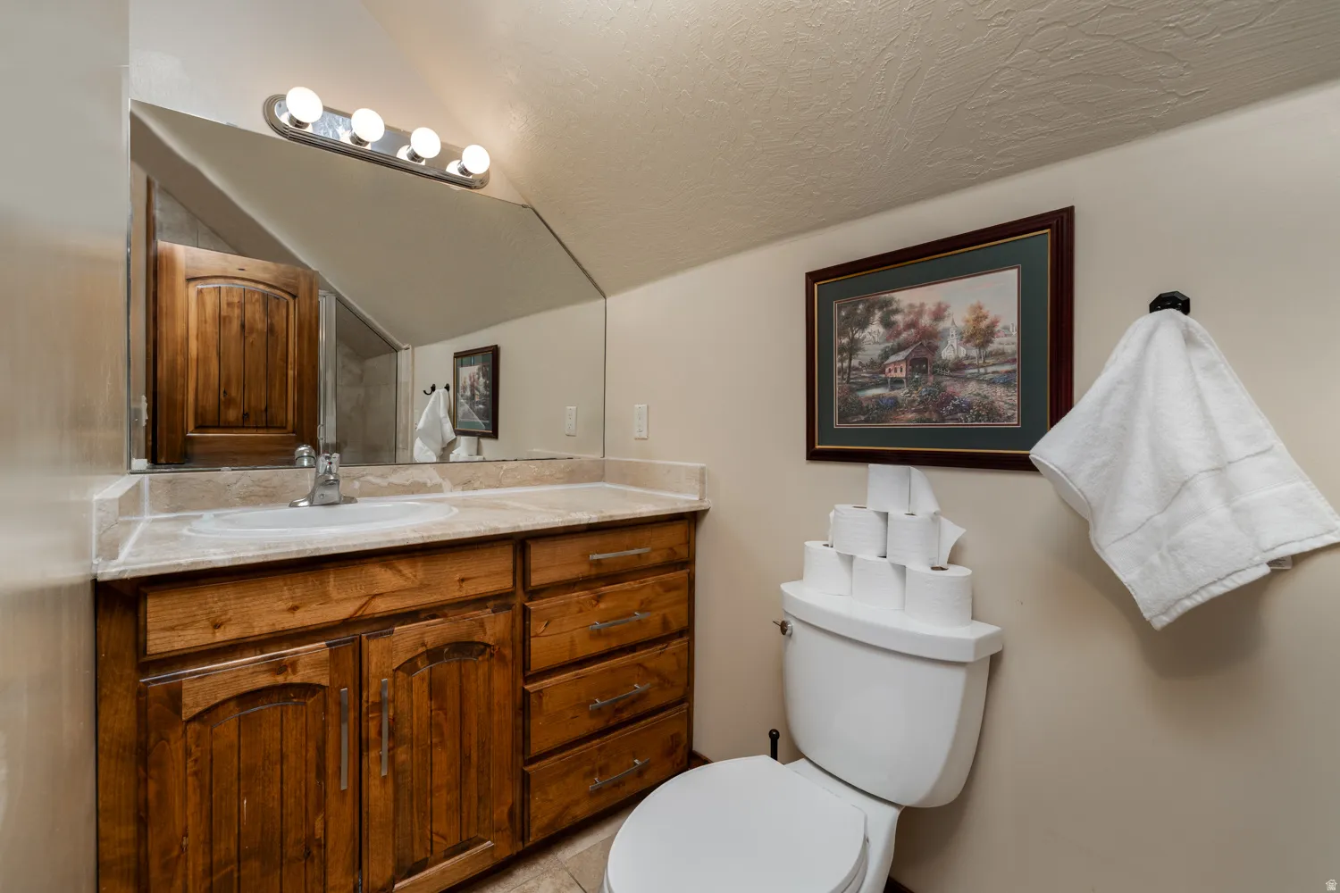 Bathroom with vanity and light tile patterned floors