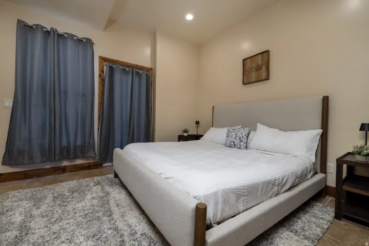 Bedroom featuring recessed lighting and tile patterned flooring