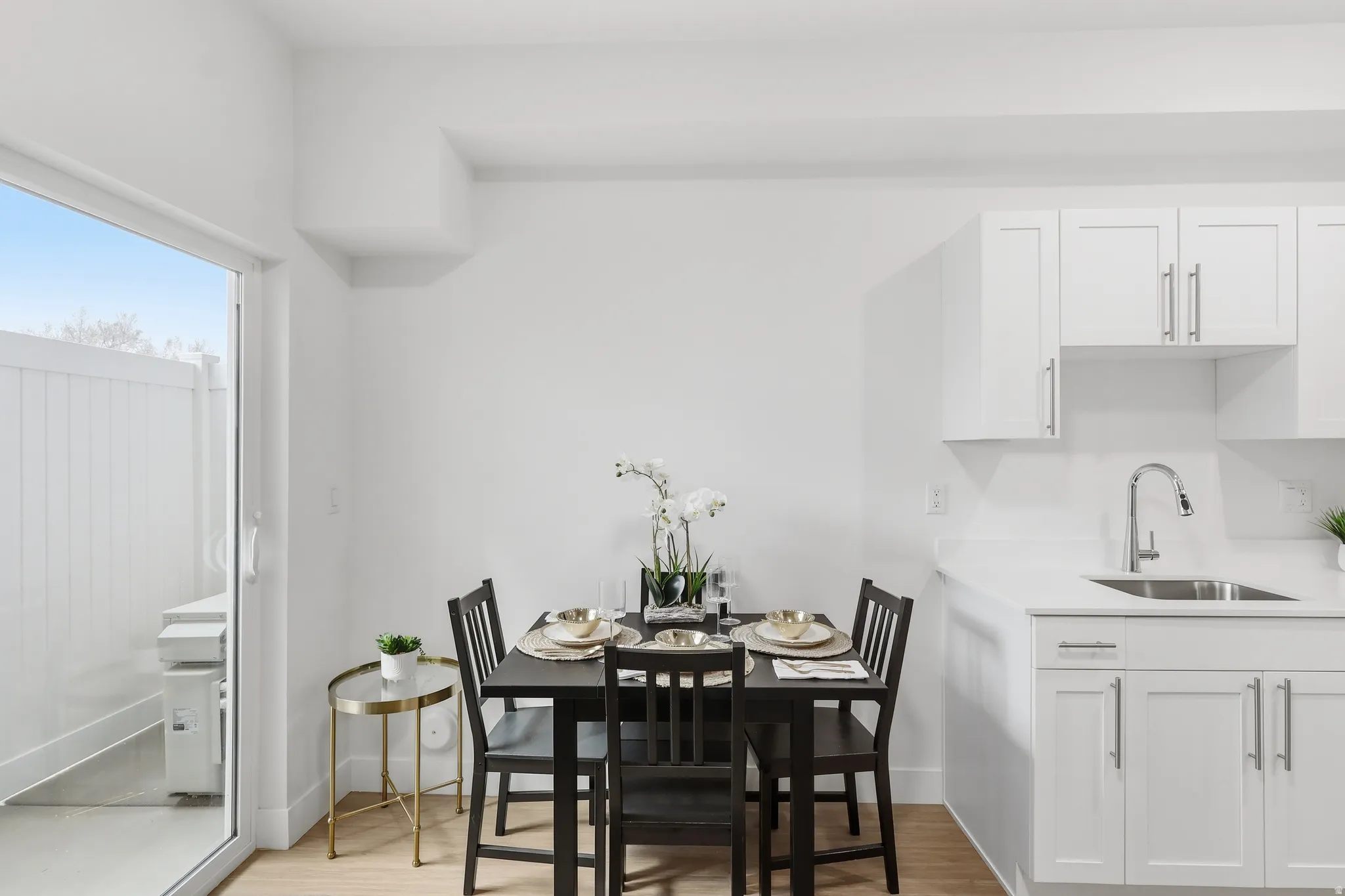 Dining space with light wood finished floors and baseboards
