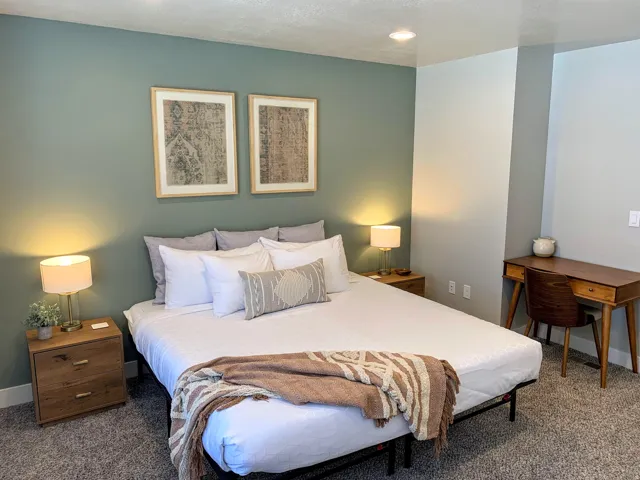 Carpeted bedroom featuring baseboards