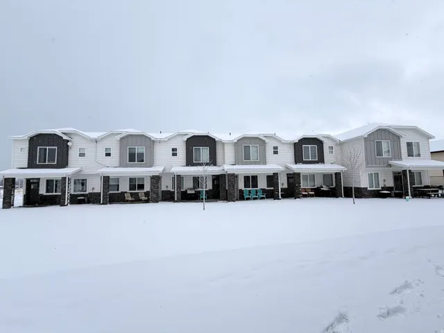 View of front facade featuring stone siding