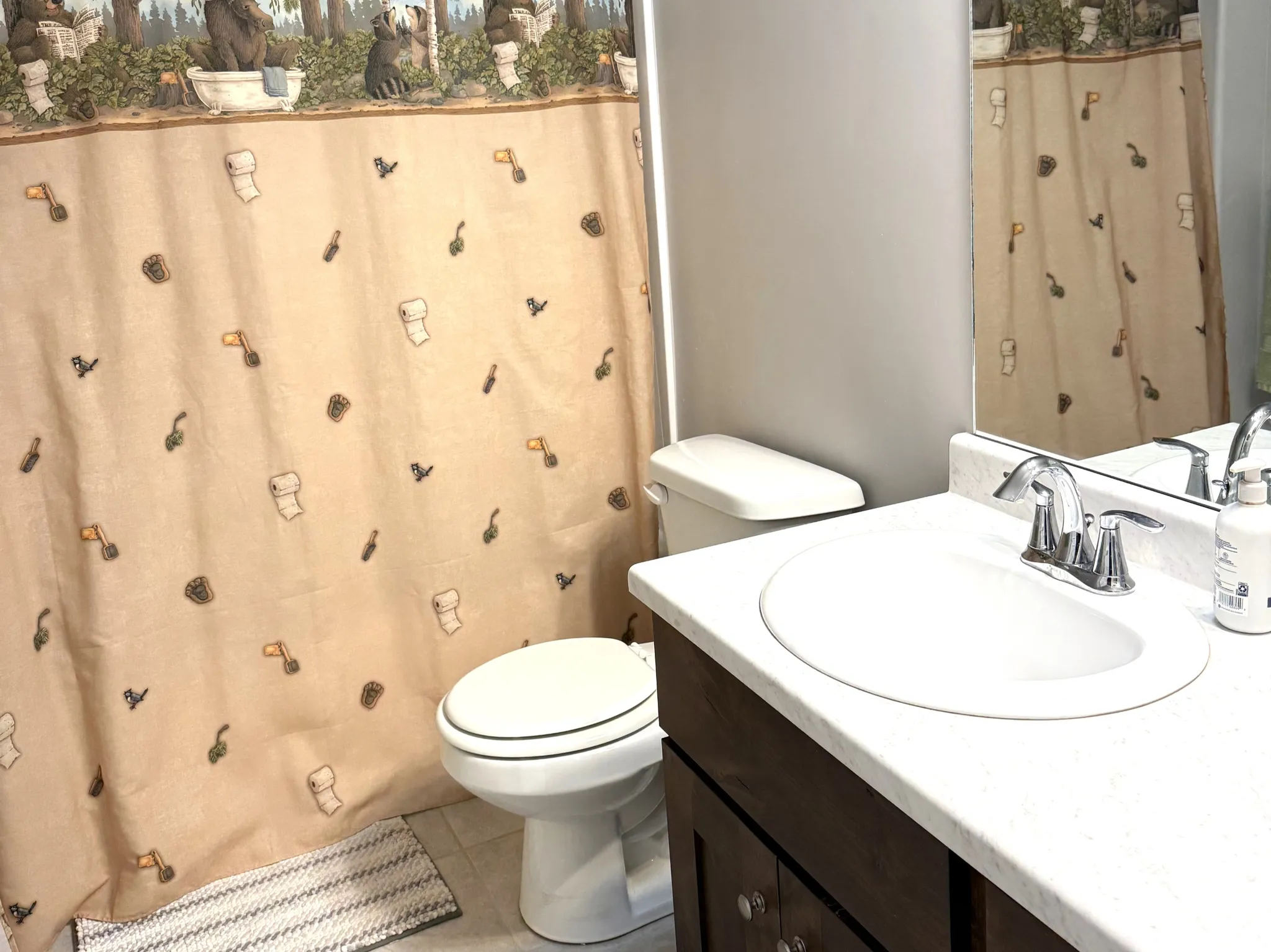 Full bathroom featuring vanity, a shower with curtain, and light tile patterned floors