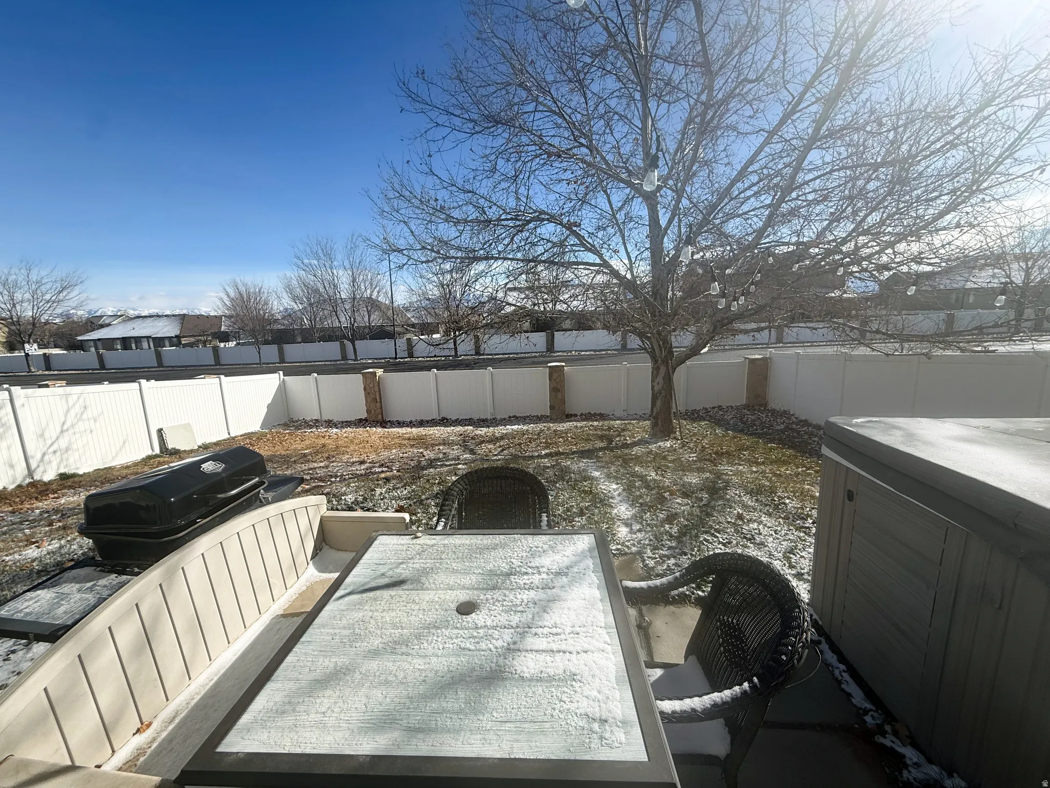 Fenced backyard featuring a patio area and outdoor dining space