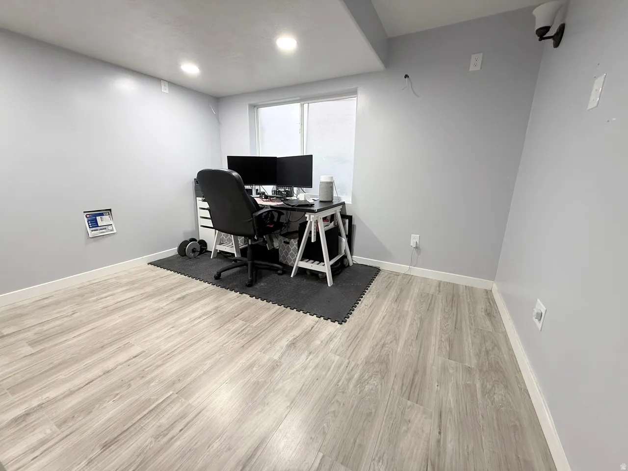Office area featuring light wood finished floors and baseboards