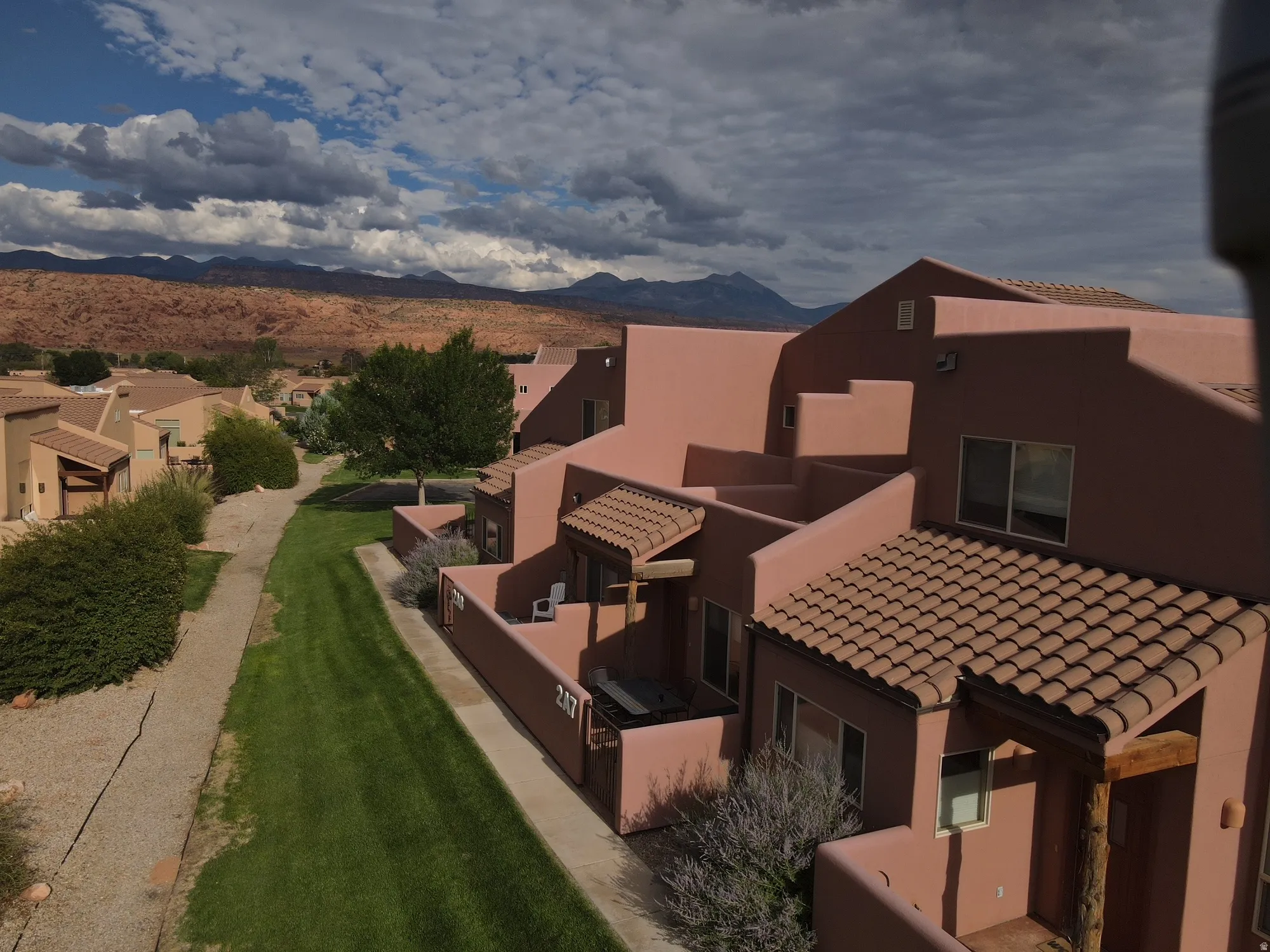 Aerial perspective of suburban area featuring a mountainous background