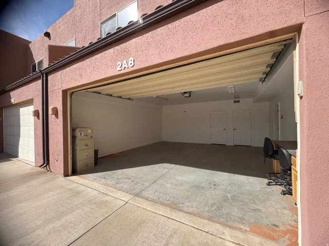 Huge 2 car garage with oversized door.  Great owners closet and work area.