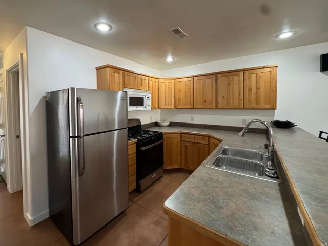 Kitchen with wood cabinets