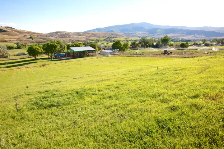 View of mountain backdrop with rural landscape