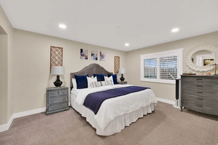 Carpeted bedroom featuring baseboards and recessed lighting
