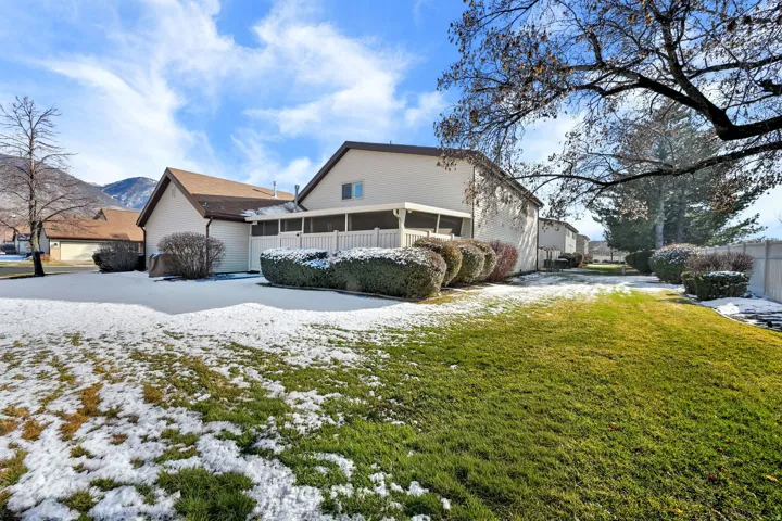 View of front of property with a yard