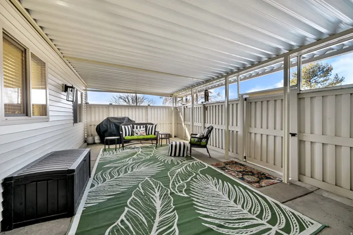 View of patio with area for grilling and outdoor lounge area