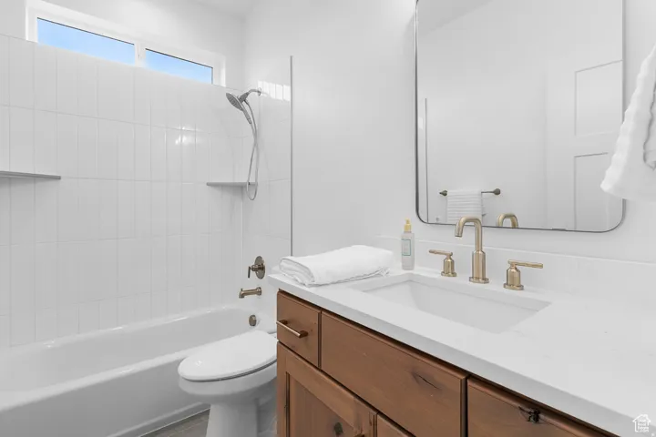 Full bath with vanity and tub / shower combination