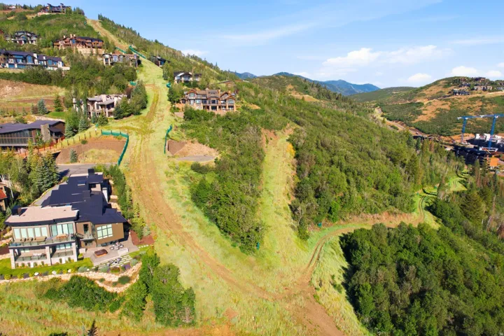 Hillside property featuring varied terrain and established trees