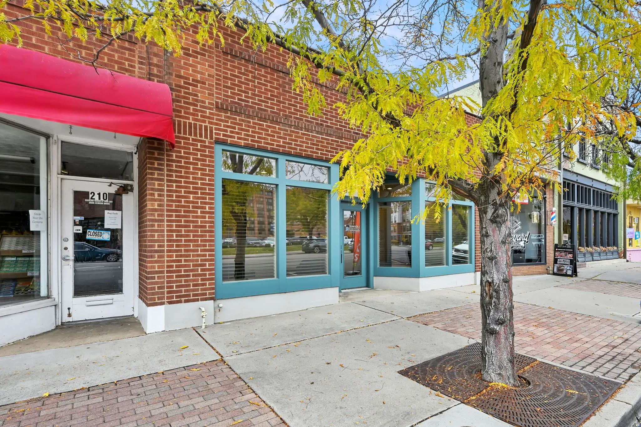 View of exterior entry with brick siding