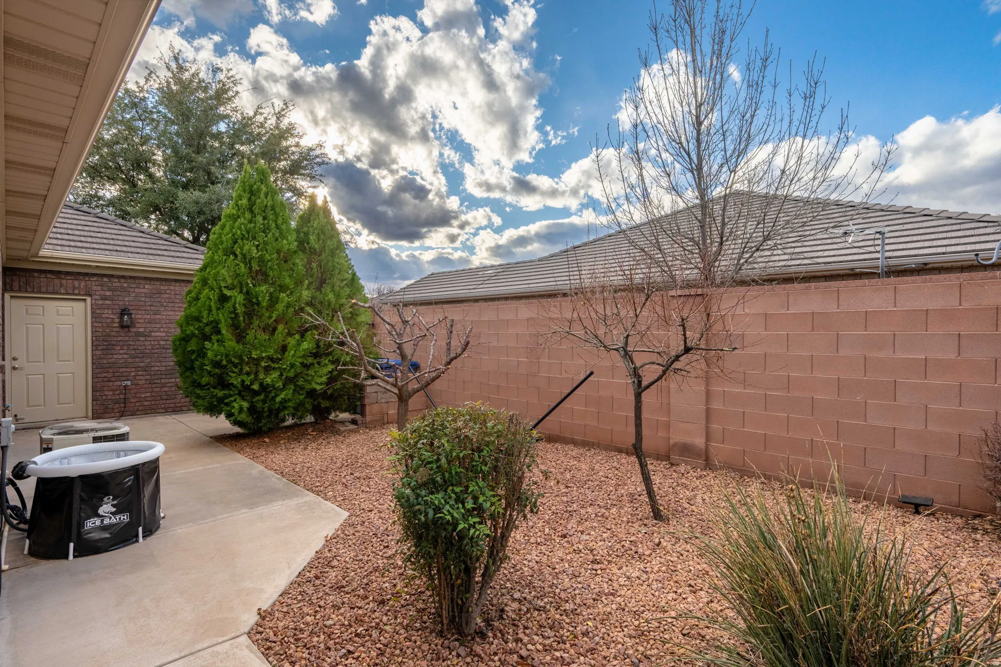 Fenced backyard with a patio area