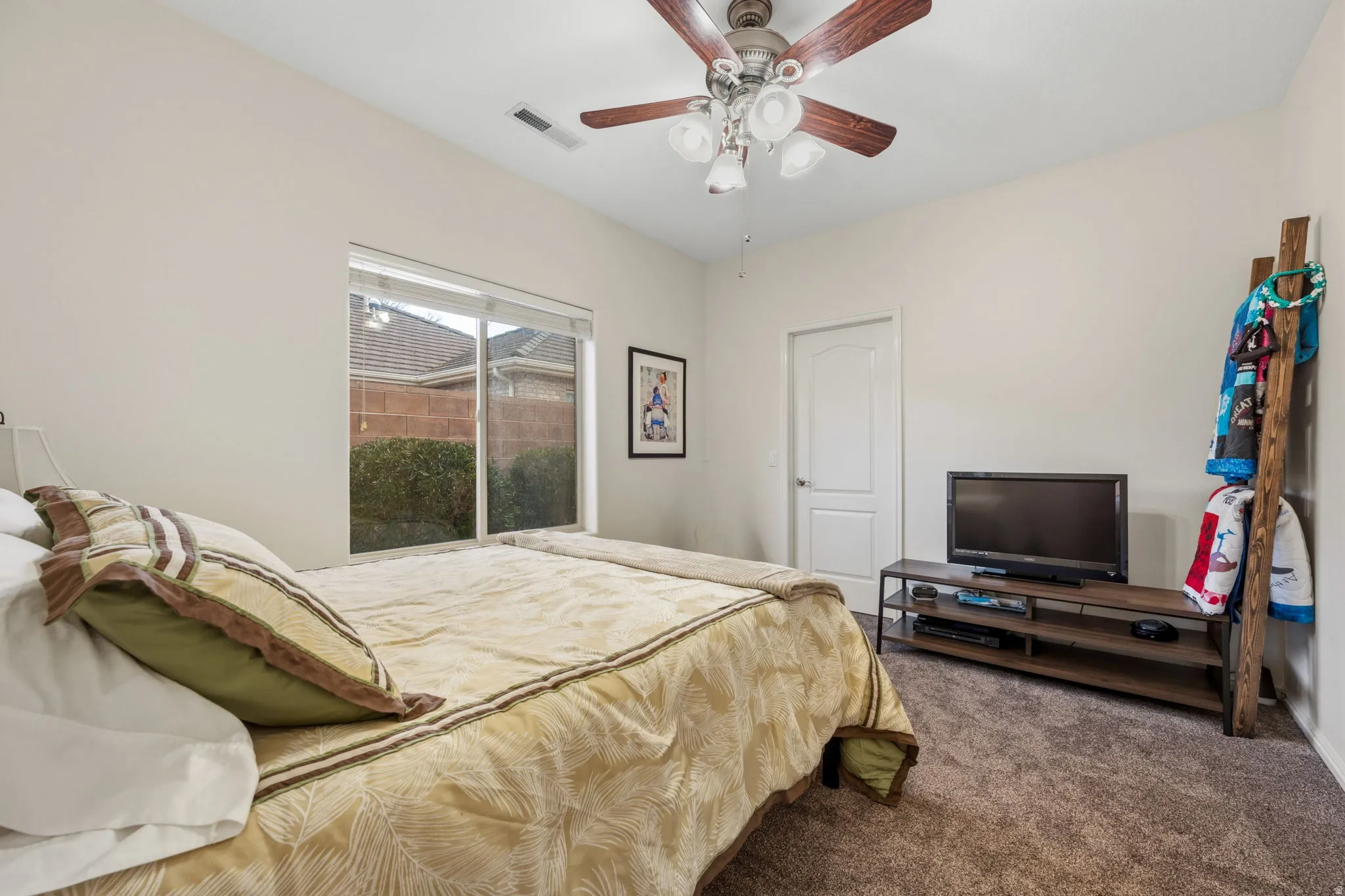 Bedroom featuring carpet floors and a ceiling fan