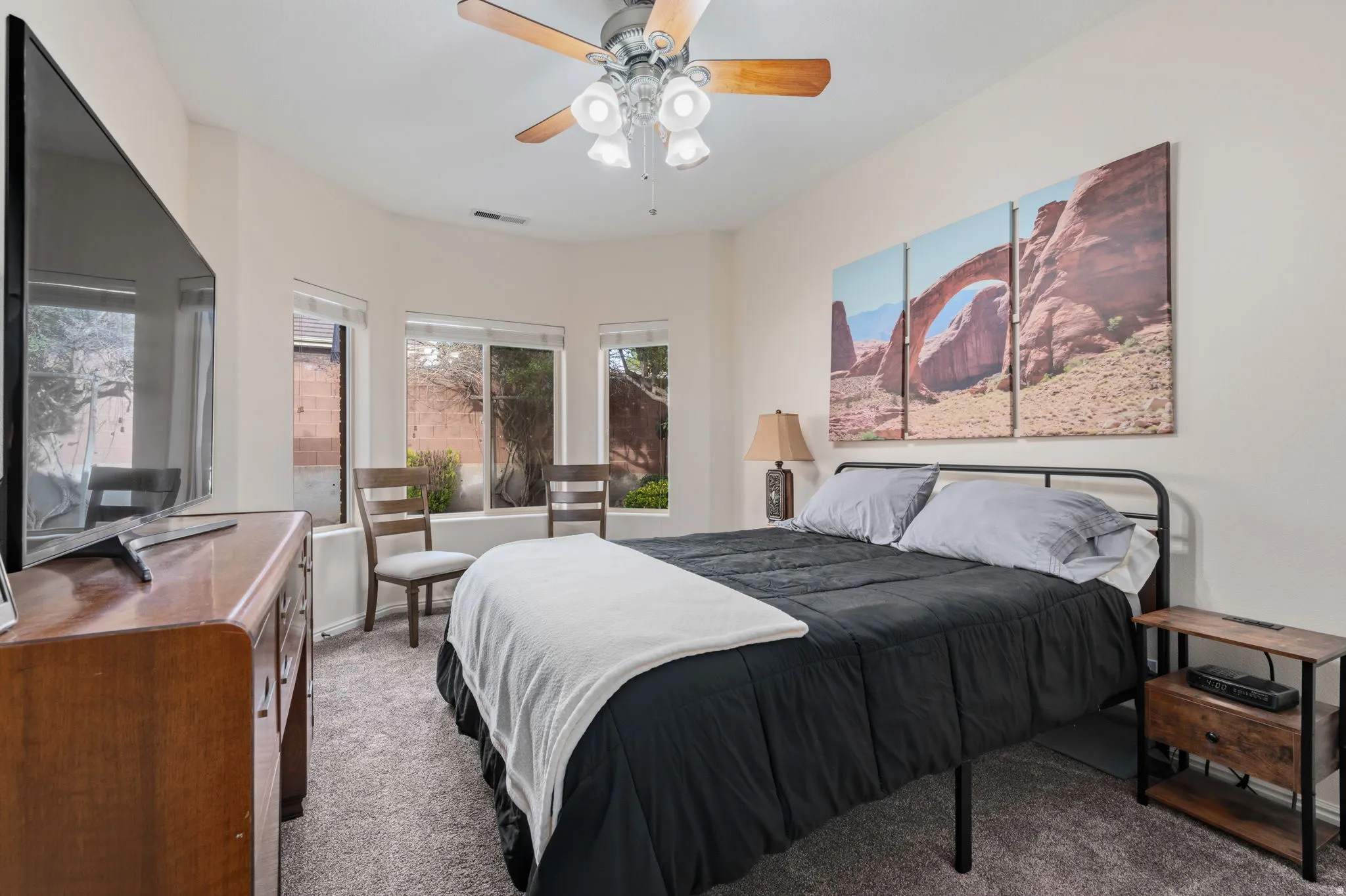 Bedroom featuring carpet and ceiling fan